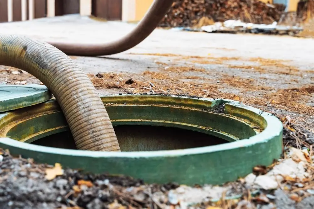 Septic tank system located in residential yard showing proper placement and tank condition