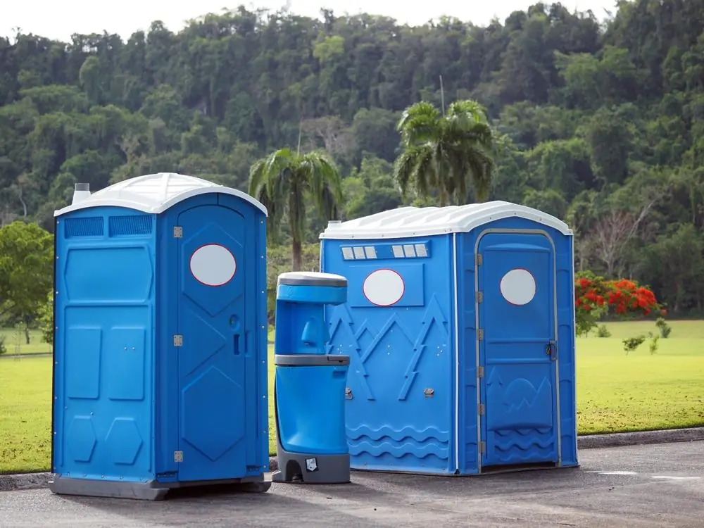 Standard and wide portable restrooms with a handwash station